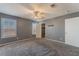 Spacious bedroom with ceiling fan, grey walls, and carpet flooring at 424 Sarajane Lane, Las Vegas, NV 89107