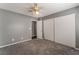 Well-lit bedroom with sliding door closet and ceiling fan at 424 Sarajane Lane, Las Vegas, NV 89107