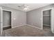 Cozy bedroom with ceiling fan, grey walls, carpet flooring and closet at 424 Sarajane Lane, Las Vegas, NV 89107