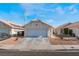 Cute one story house with a single car garage and desert landscaping at 424 Sarajane Lane, Las Vegas, NV 89107