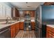 Modern kitchen with dark wood cabinets and stainless steel appliances at 424 Sarajane Lane, Las Vegas, NV 89107