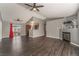 Open living room with dark laminate floors and a view into the kitchen at 424 Sarajane Lane, Las Vegas, NV 89107