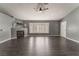 Spacious living room featuring dark laminate floors, a fireplace, and a bay window at 424 Sarajane Lane, Las Vegas, NV 89107