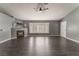 Spacious living room featuring dark laminate floors, a fireplace, and a bay window at 424 Sarajane Lane, Las Vegas, NV 89107