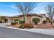 View of the home's exterior, showcasing its stone facade and landscaping at 4356 La Romita St # 2, Pahrump, NV 89061