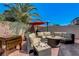 Backyard patio with circular seating, fire pit, and BBQ grill at 448 Bright Moon Ave, North Las Vegas, NV 89084