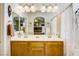 Double vanity bathroom with a large mirror and a white shower curtain at 448 Bright Moon Ave, North Las Vegas, NV 89084