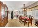 Elegant dining room with a large table, chairs, and a beautiful china cabinet at 448 Bright Moon Ave, North Las Vegas, NV 89084