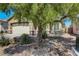 Front yard with tree and desert landscaping at 448 Bright Moon Ave, North Las Vegas, NV 89084