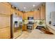 Modern kitchen with stainless steel appliances and light wood cabinetry at 448 Bright Moon Ave, North Las Vegas, NV 89084