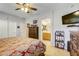 Main bedroom with king bed, dresser, TV, and ensuite bathroom access at 448 Bright Moon Ave, North Las Vegas, NV 89084