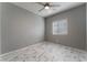 Bright bedroom with ceiling fan and marble-look tile floors at 4625 Ridgeley Ave # 103, North Las Vegas, NV 89084