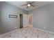 Bedroom with ceiling fan, double-door closet and marble-look floors at 4625 Ridgeley Ave # 103, North Las Vegas, NV 89084