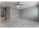 Primary bedroom with ceiling fan and marble-look floors at 4625 Ridgeley Ave # 103, North Las Vegas, NV 89084