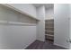 Spacious walk-in closet with built-in shelving and hanging rods at 4625 Ridgeley Ave # 103, North Las Vegas, NV 89084