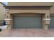 Attached two-car garage with brick pavers at 4625 Ridgeley Ave # 103, North Las Vegas, NV 89084