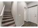 Upstairs hallway with carpeted staircase and doors to bedrooms at 4625 Ridgeley Ave # 103, North Las Vegas, NV 89084