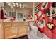 Bright bathroom features a Mickey Mouse shower curtain, sink, and mirrored cabinet at 471 Eagle Vista Dr, Henderson, NV 89012