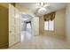 Bright, neutral bedroom featuring tile flooring and arched doorway to additional space at 471 Eagle Vista Dr, Henderson, NV 89012