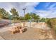 Bocce ball courts with shaded seating, a stone table and mature landscaping nearby at 471 Eagle Vista Dr, Henderson, NV 89012