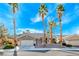 Charming single-story home featuring a 2-car garage and lush palm tree landscaping at 471 Eagle Vista Dr, Henderson, NV 89012