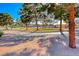 Scenic view of tree-lined neighborhood street with lush trees and landscaping at 471 Eagle Vista Dr, Henderson, NV 89012