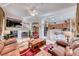 Comfortable living room with a fireplace and open floor plan, seamlessly connecting to the kitchen and dining areas at 471 Eagle Vista Dr, Henderson, NV 89012