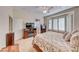 Inviting main bedroom with a king bed, fireplace, bay window, and shutter blinds for added privacy at 471 Eagle Vista Dr, Henderson, NV 89012