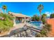 Spacious patio featuring a pool and spa with lounge chairs and desert views at 471 Eagle Vista Dr, Henderson, NV 89012