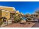 Beautiful backyard with a pool, spa, covered patio, and lush landscaping at 5635 Exotic Rosette Ave, Las Vegas, NV 89139