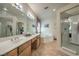 Spa-like bathroom with double sinks, a tub, and a shower at 5635 Exotic Rosette Ave, Las Vegas, NV 89139