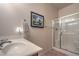 Modern bathroom with a glass-enclosed shower and a sleek vanity, and a towel rack at 5635 Exotic Rosette Ave, Las Vegas, NV 89139