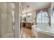 Elegant bathroom with double vanity, soaking tub, and shower at 5635 Exotic Rosette Ave, Las Vegas, NV 89139