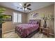 Comfortable bedroom featuring a ceiling fan, plush rug, and stylish decor at 5635 Exotic Rosette Ave, Las Vegas, NV 89139