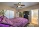 Spacious bedroom with a ceiling fan, closet, and ensuite bathroom at 5635 Exotic Rosette Ave, Las Vegas, NV 89139