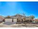 Charming single-story home with desert landscaping, three-car garage, and a tiled roof at 5635 Exotic Rosette Ave, Las Vegas, NV 89139