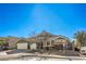 Charming single-story home featuring desert landscaping, three-car garage, and a tiled roof at 5635 Exotic Rosette Ave, Las Vegas, NV 89139