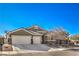 Charming single-story home with desert landscaping, three-car garage, and a tiled roof at 5635 Exotic Rosette Ave, Las Vegas, NV 89139