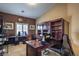 Home office with built-in wooden desk and shelving at 5635 Exotic Rosette Ave, Las Vegas, NV 89139