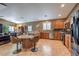 Open kitchen with a breakfast bar, stainless steel appliances, and ample counter space at 5635 Exotic Rosette Ave, Las Vegas, NV 89139