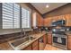 Well-equipped kitchen with granite countertops and stainless steel appliances at 5635 Exotic Rosette Ave, Las Vegas, NV 89139