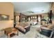 Expansive main bedroom features high ceilings, a sitting area, and an en-suite bathroom at 5635 Exotic Rosette Ave, Las Vegas, NV 89139