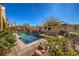 Private pool with a waterfall feature, raised spa, mature landscaping, and a serene backyard at 5635 Exotic Rosette Ave, Las Vegas, NV 89139