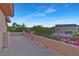 Expansive outdoor balcony with decorative railing, offering scenic neighborhood views on a sunny day at 5734 San Florentine Ave, Las Vegas, NV 89141