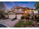 Beautiful two-story home with a three-car garage, desert landscaping and solar panels at 5734 San Florentine Ave, Las Vegas, NV 89141