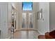 Beautiful foyer showcasing a gorgeous tiled landing and double door entry, with natural light streaming in at 5734 San Florentine Ave, Las Vegas, NV 89141