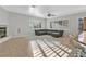 Spacious living room with a fireplace, plantation shutters, and tile flooring at 5734 San Florentine Ave, Las Vegas, NV 89141