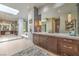 Spa-like bathroom featuring a large vanity, soaking tub, and walk-in shower at 583 Saint Croix St, Henderson, NV 89012