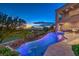 Modern pool and spa with a dramatic curve and city views at 583 Saint Croix St, Henderson, NV 89012