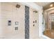 Sleek shower with multiple shower heads and modern tile design at 583 Saint Croix St, Henderson, NV 89012